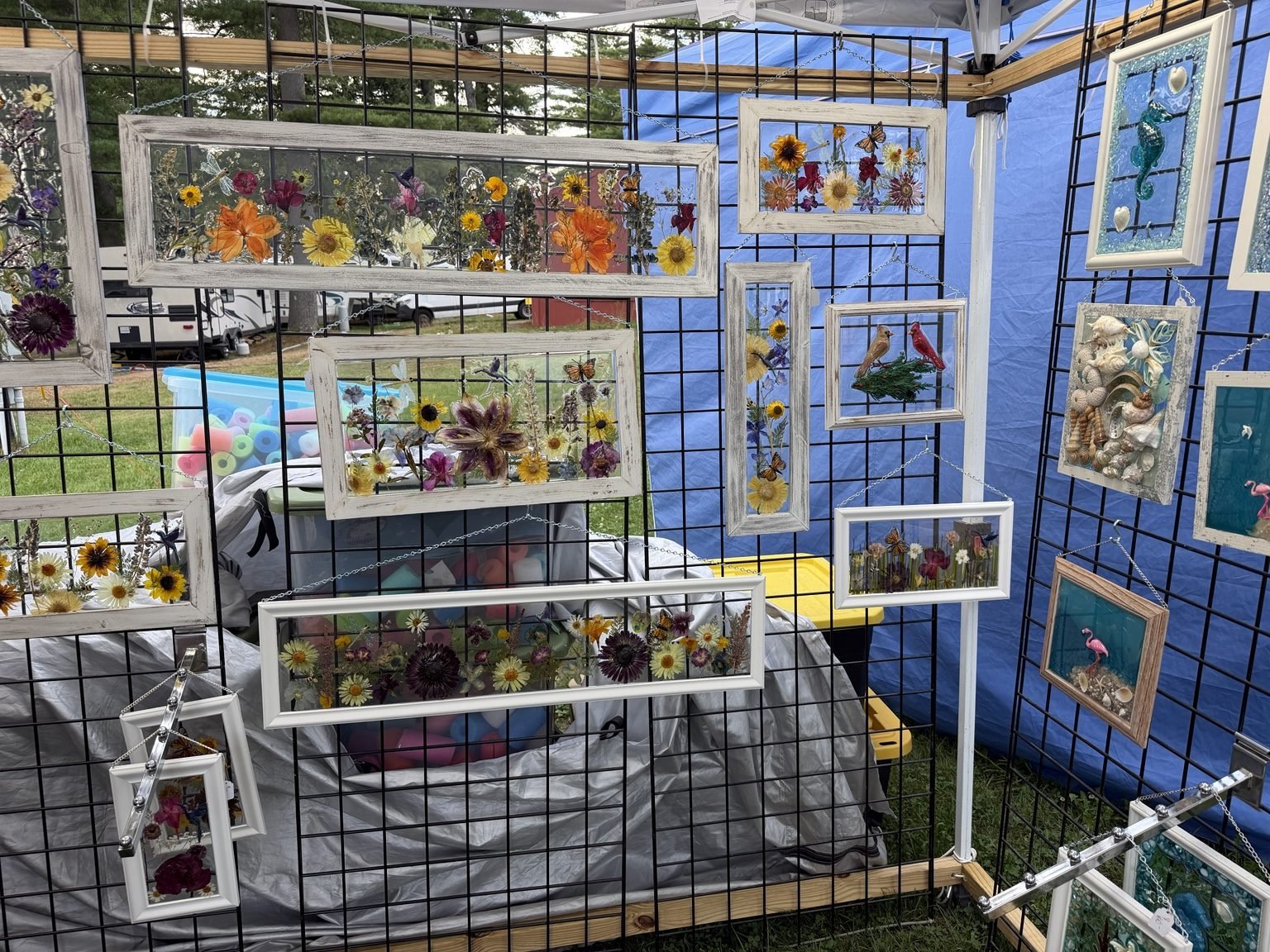 Handmade artwork on display at a Vermont craft fair booth