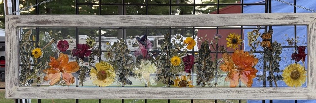 Handmade dimensional frame with layered wildflowers and a monarch butterfly