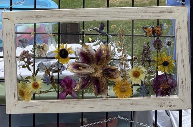Handmade dimensional frame with a large lily and layered wildflowers